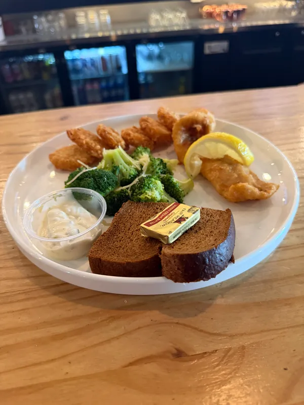 Beer-battered walleye with broccoli, marble rye bread, tartar sauce and lemon